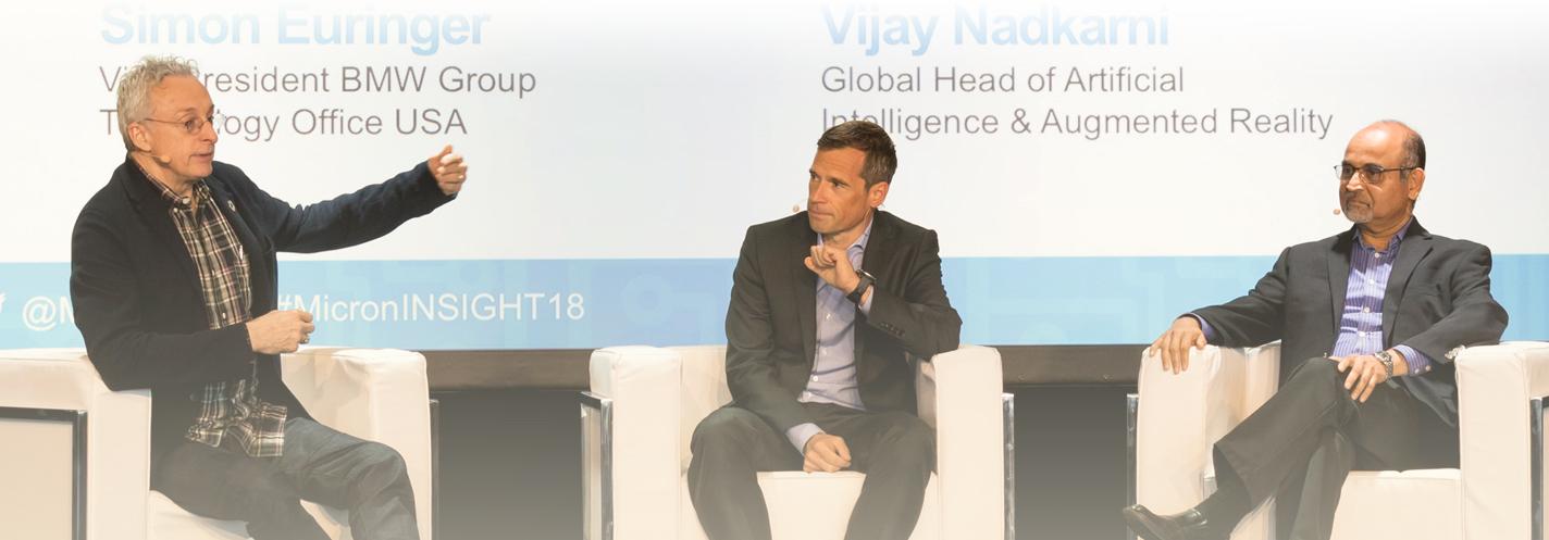 3 men on stage having a conversation