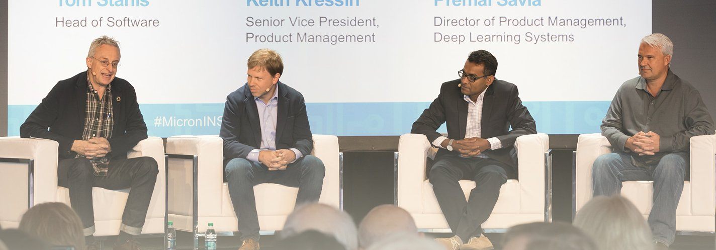 Panelists sitting on stage