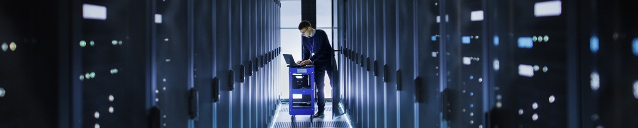 A man working in a data center room