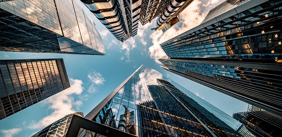 vertical shot of buildings taken from ground focused up