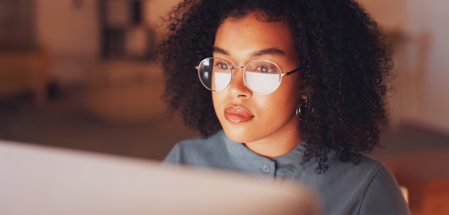 Woman sitting looking at a monitor
